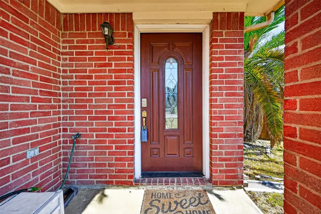a view of a hallway with wooden door