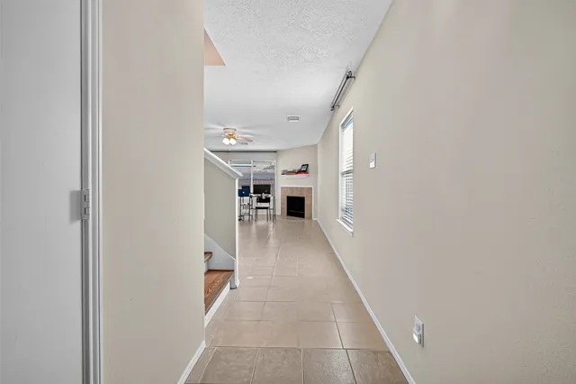 a view of livingroom with furniture fireplace and window