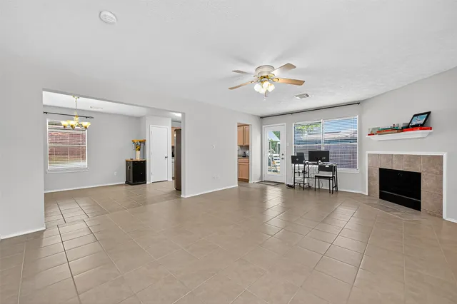 an empty room with closet and windows