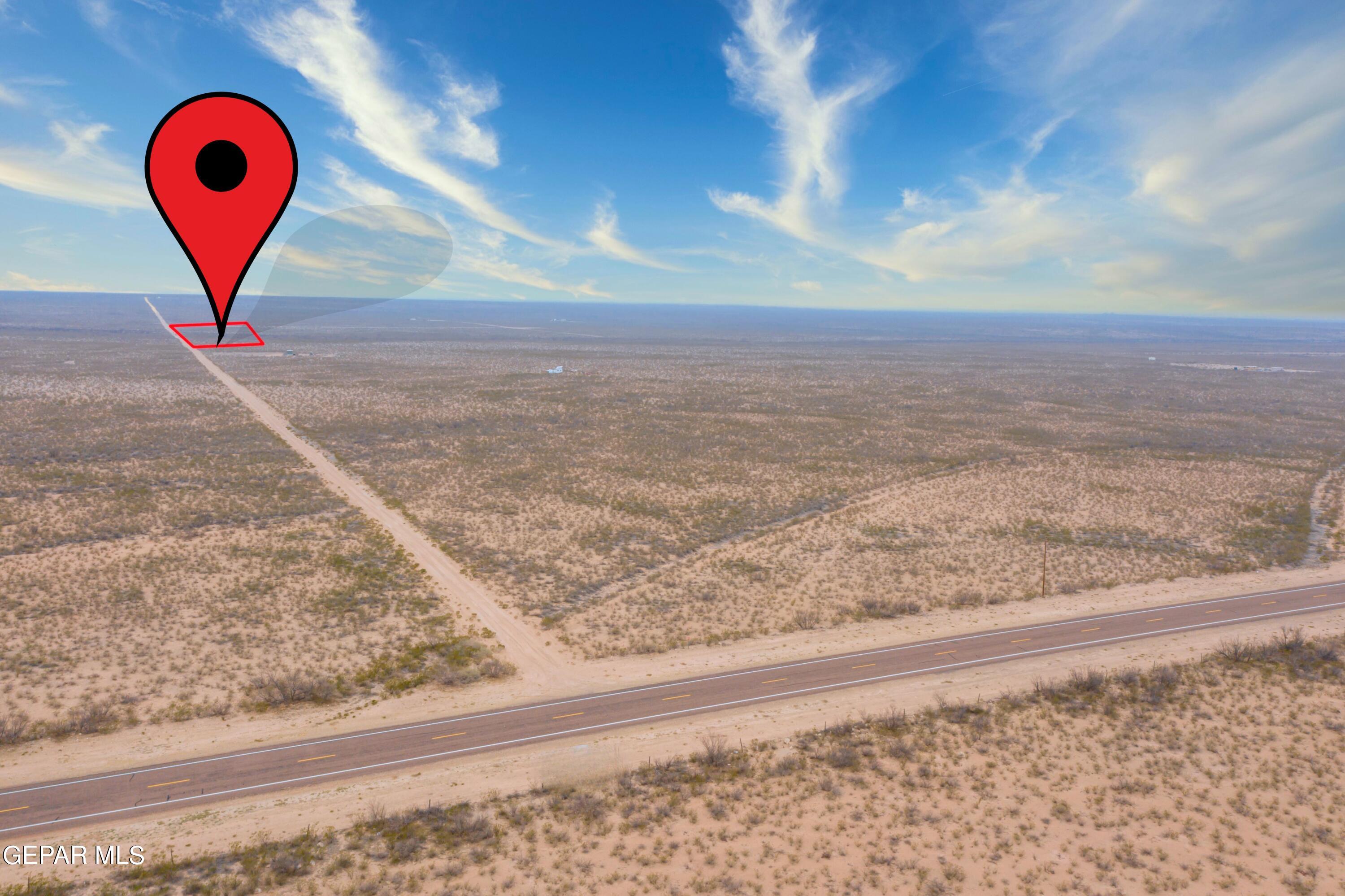20 Guadalupe Ranch Road Dell City, TX 79847 - Photo 2 of 14 a view of a street with a road sign