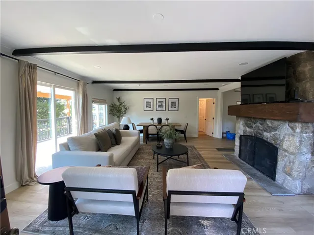 a living room with a couch and a potted plant