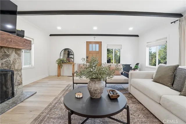 a living room with furniture a table and a window