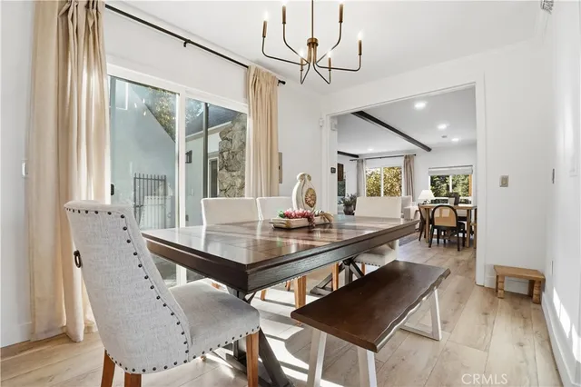 a kitchen with granite countertop stainless steel appliances and wooden floor
