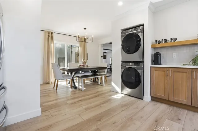 a kitchen with stainless steel appliances a refrigerator sink and microwave