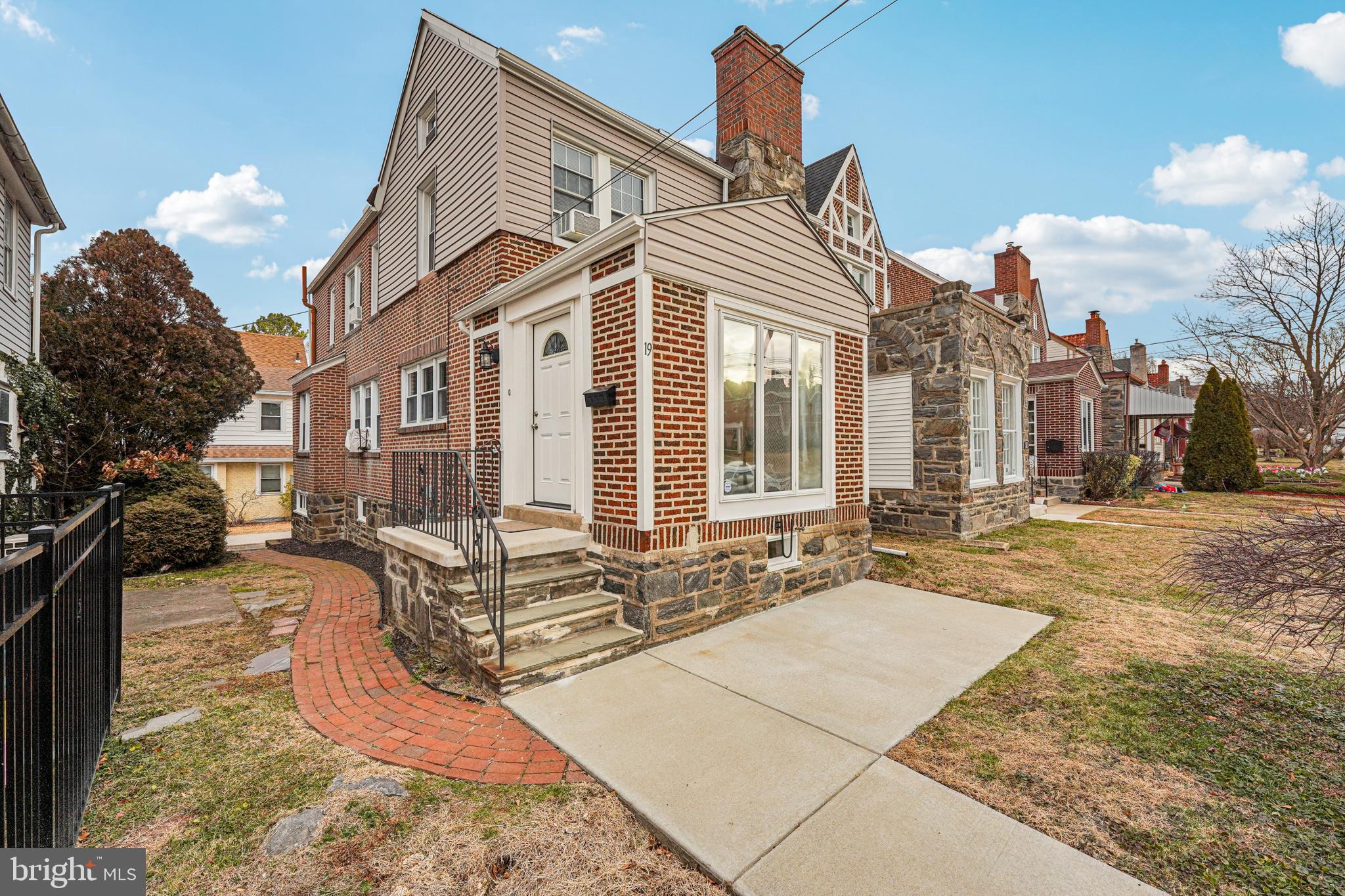 19 Wayne Avenue Springfield, PA 19064 - Photo 1 of 56 a view of a building with many windows