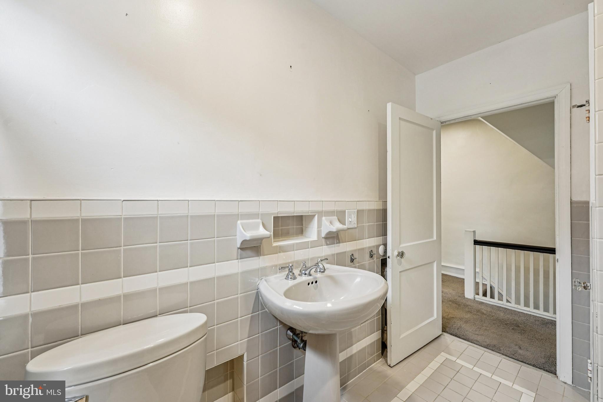 19 Wayne Avenue Springfield, PA 19064 - Photo 24 of 56 a bathroom with a sink a toilet and a mirror