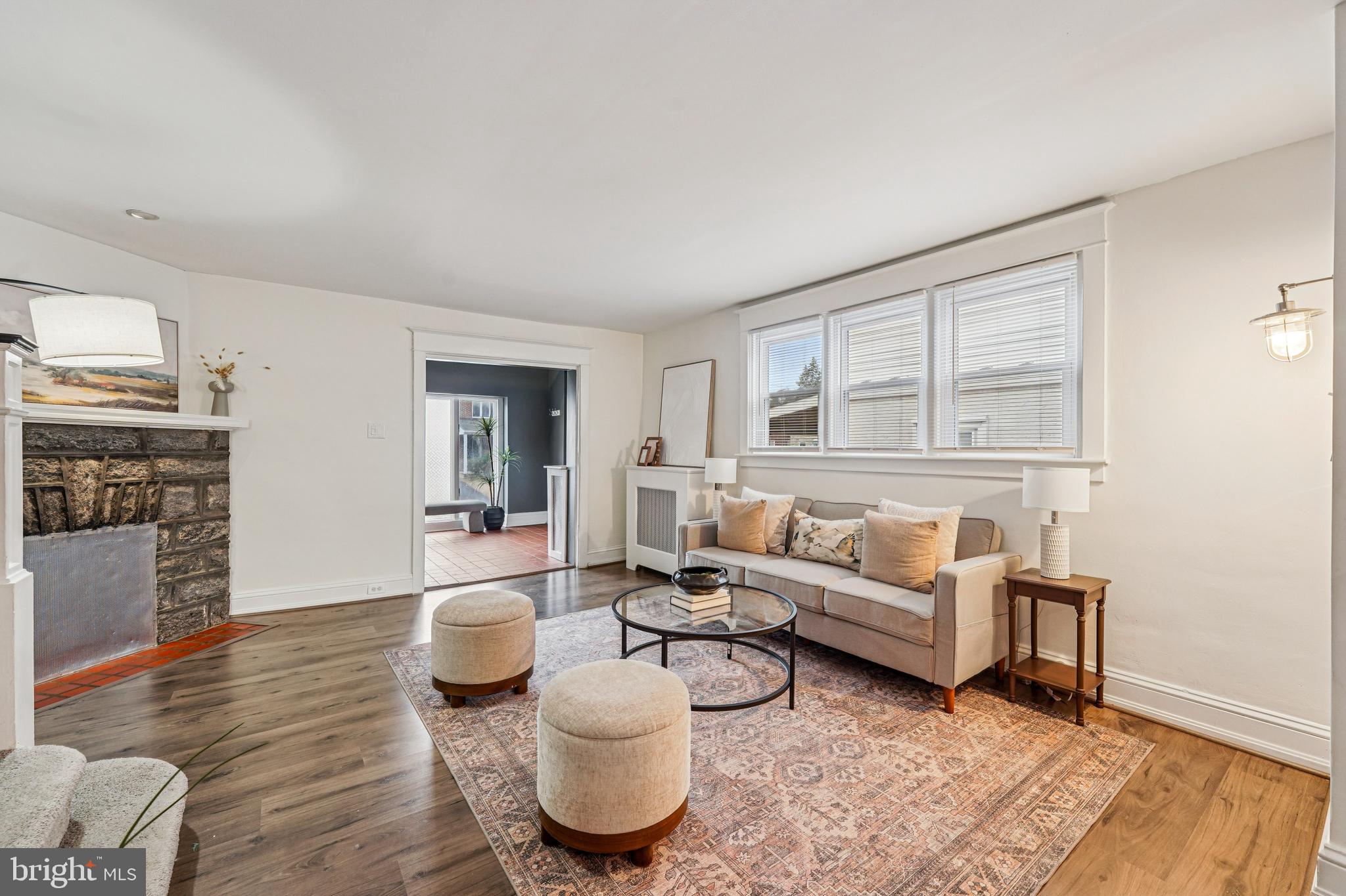19 Wayne Avenue Springfield, PA 19064 - Photo 4 of 56 a living room with furniture and a fireplace
