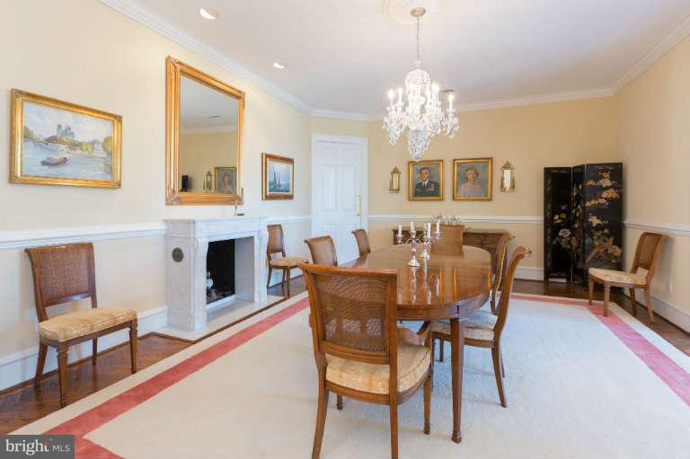 626 Chain Bridge Road McLean, VA 22101 - Photo 13 of 30 a view of a dining room with furniture a chandelier and wooden floor