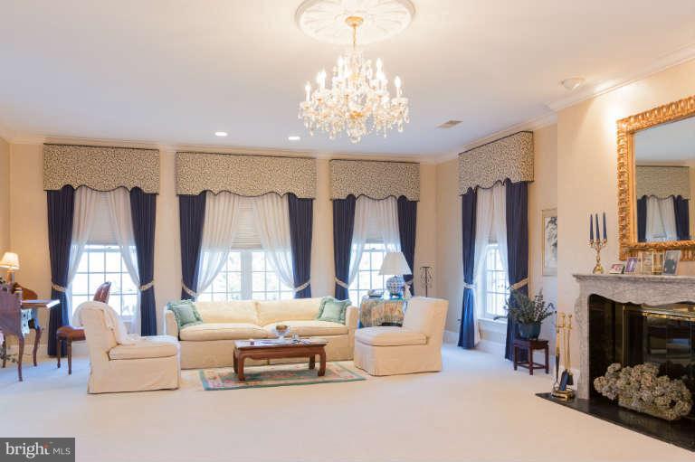 626 Chain Bridge Road McLean, VA 22101 - Photo 16 of 30 a living room with furniture and a chandelier