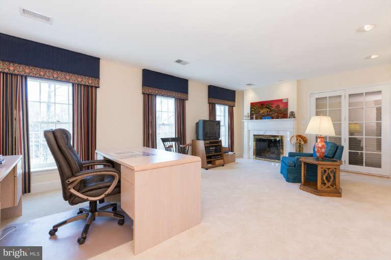 626 Chain Bridge Road McLean, VA 22101 - Photo 23 of 30 a view of a livingroom with furniture and a flat screen tv