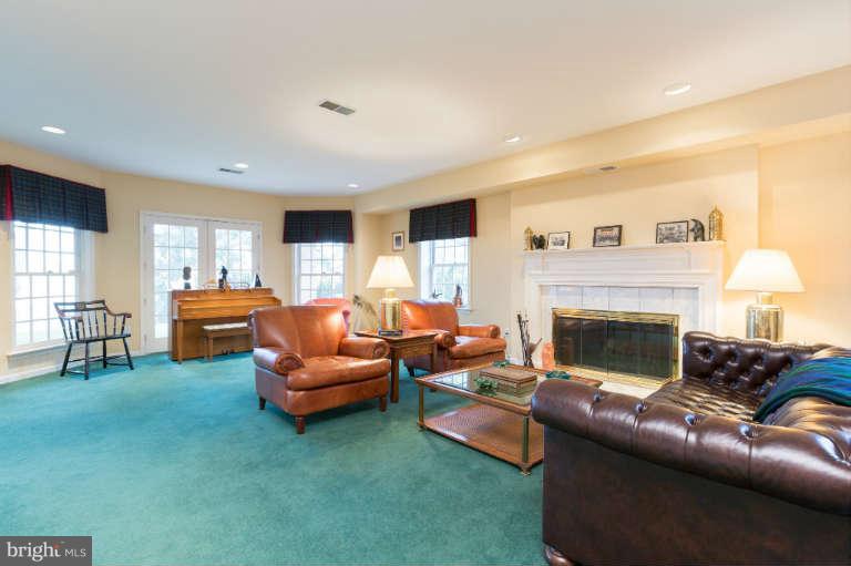 626 Chain Bridge Road McLean, VA 22101 - Photo 25 of 30 a living room with furniture and a fireplace