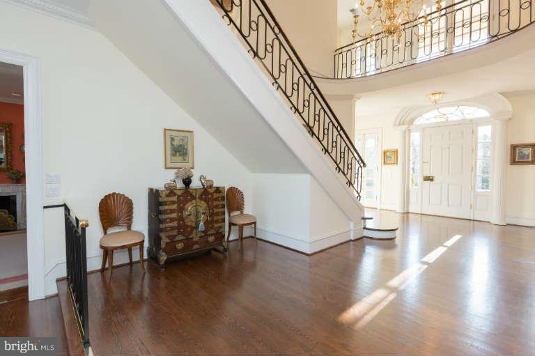 626 Chain Bridge Road McLean, VA 22101 - Photo 5 of 30 a dining room with wooden floor and stairs