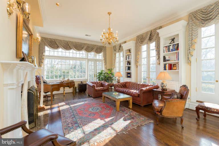 626 Chain Bridge Road McLean, VA 22101 - Photo 6 of 30 a living room with furniture fireplace and large windows