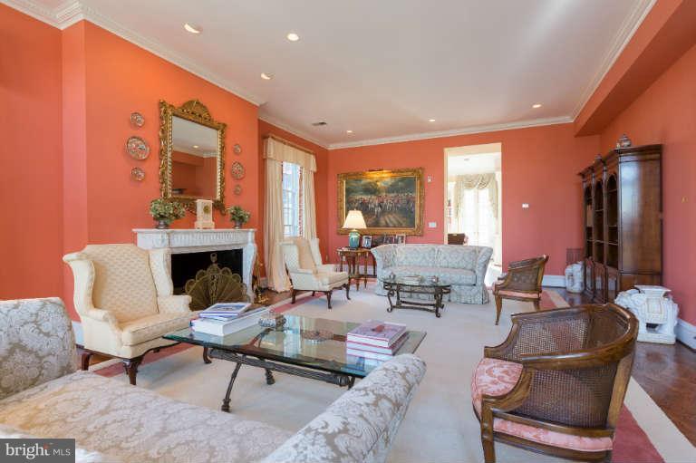 626 Chain Bridge Road McLean, VA 22101 - Photo 9 of 30 a living room with furniture a fireplace and a table