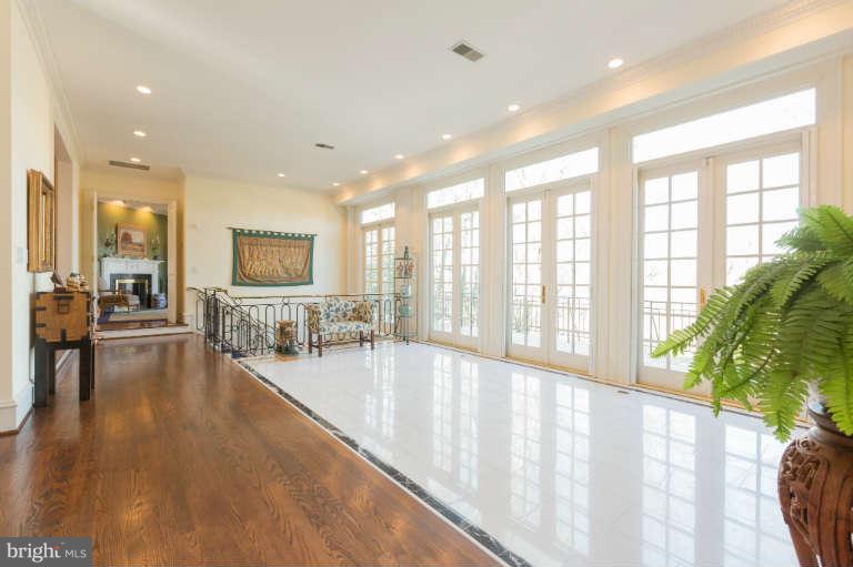 626 Chain Bridge Road McLean, VA 22101 - Photo 10 of 30 a view of an entryway with wooden floor and windows