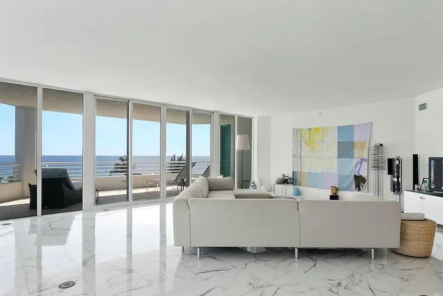 a bedroom with a bed and large window