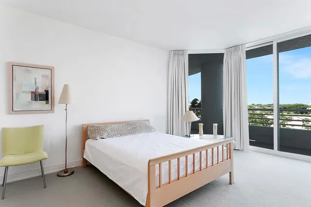 a view of swimming pool with outdoor seating and plants