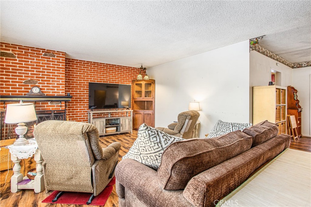217 Syllmar Circle Calimesa, CA 92320 - Photo 5 of 28 a bedroom with furniture and a flat screen tv