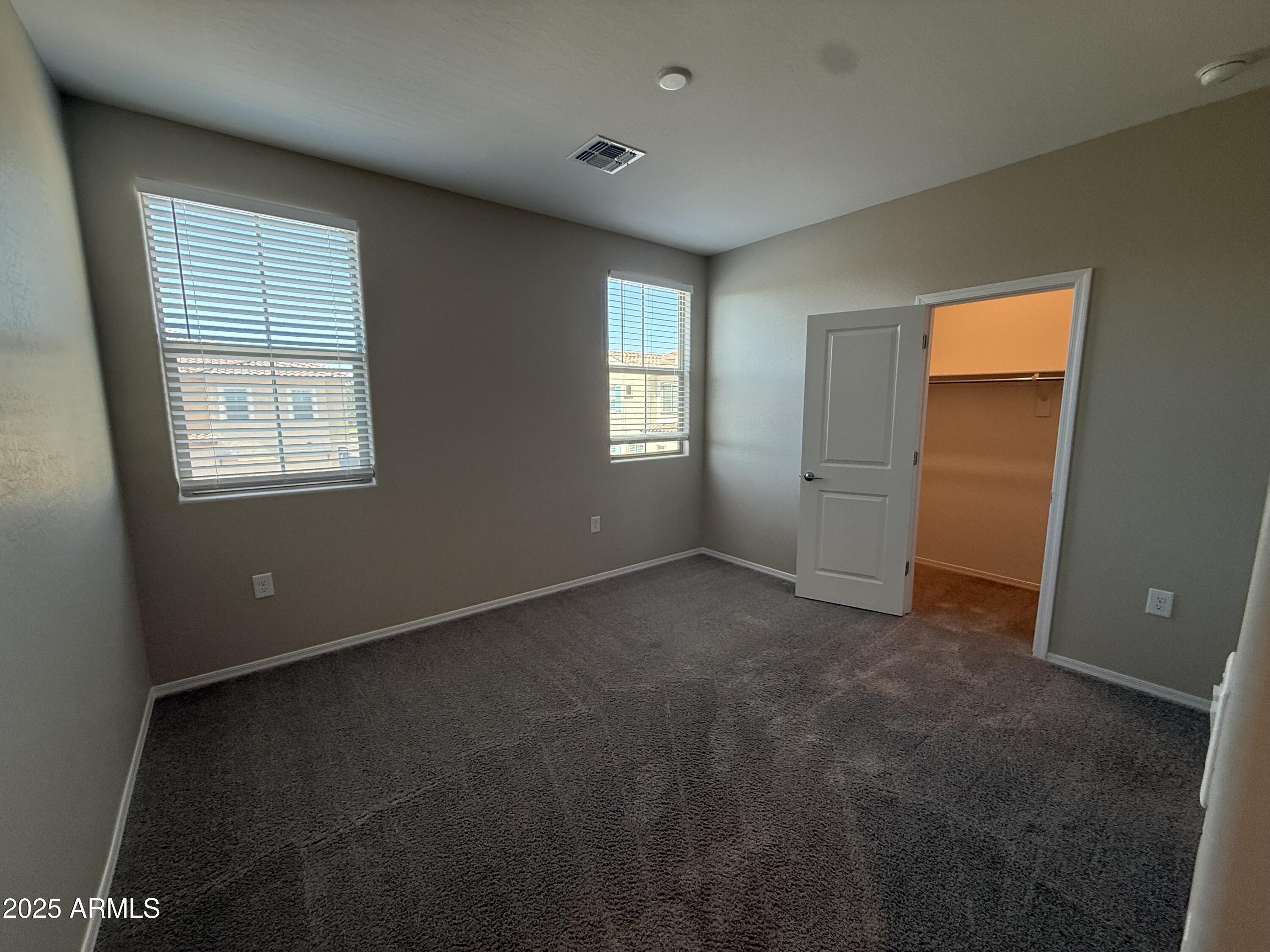1959 East Hampton Lane, Unit 101 Gilbert, AZ 85295 - Photo 18 of 23 an empty room with windows