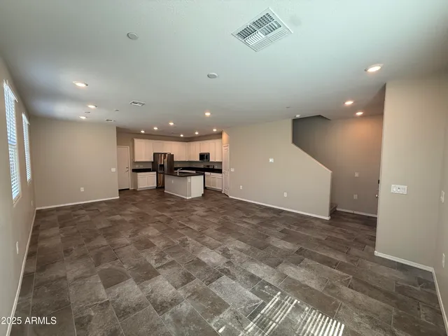a view of kitchen with a sink and a stove