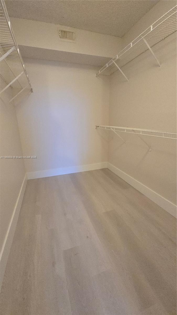 8851 Wiles Road, Unit 103 Coral Springs, FL 33067 - Photo 15 of 23 a view of a room with an empty space