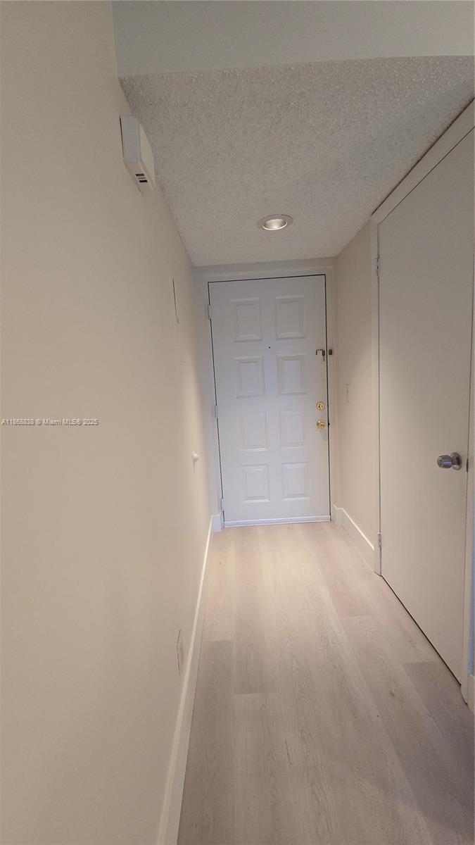 8851 Wiles Road, Unit 103 Coral Springs, FL 33067 - Photo 23 of 23 a view of an empty room