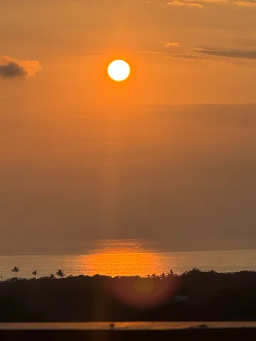 a living room with furniture fireplace and a table