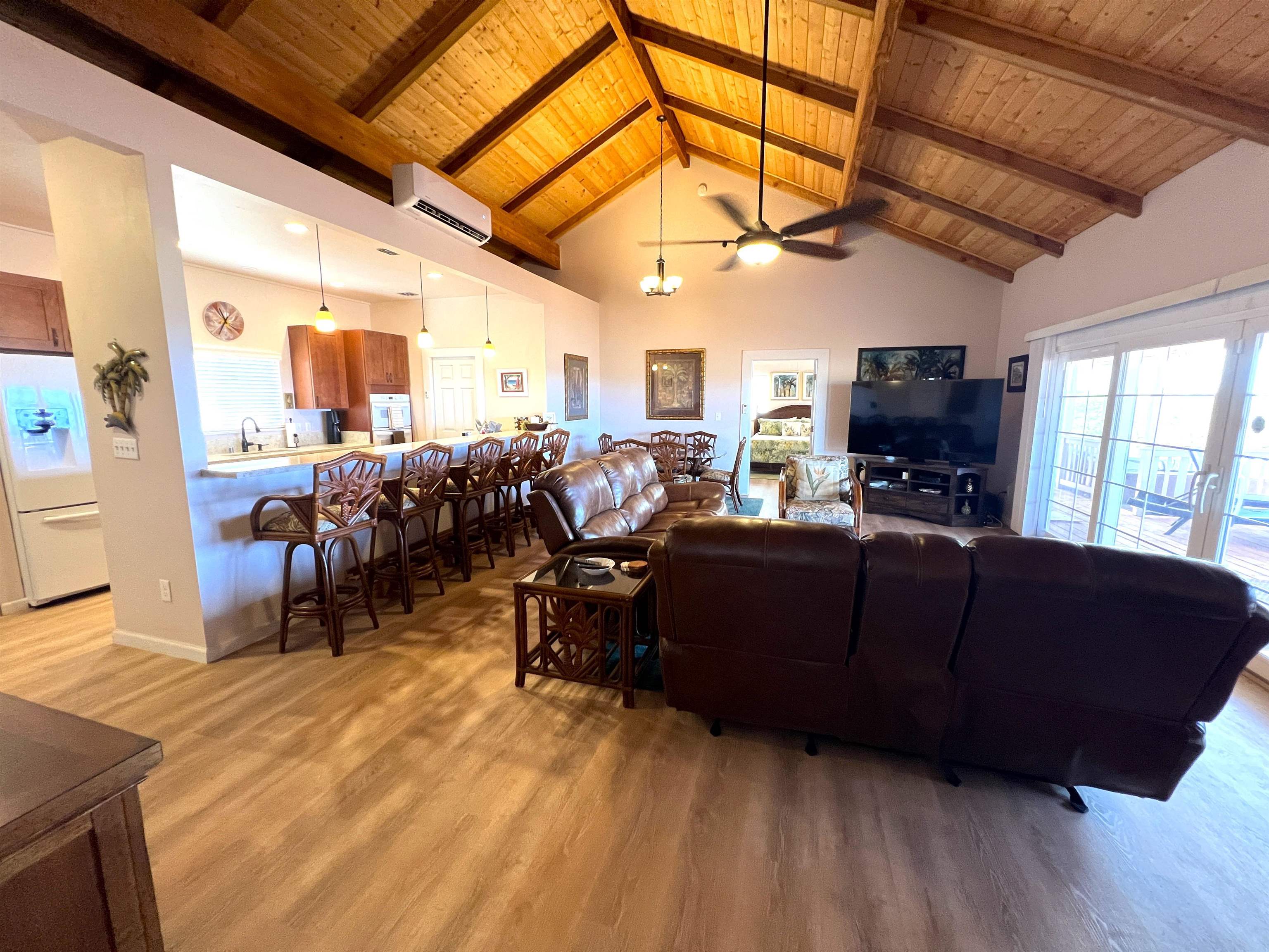 403 Pa Loa Loop, Unit LOT #221 Maunaloa, HI 96770 - Photo 14 of 33 a living room with furniture a flat screen tv and next to a window