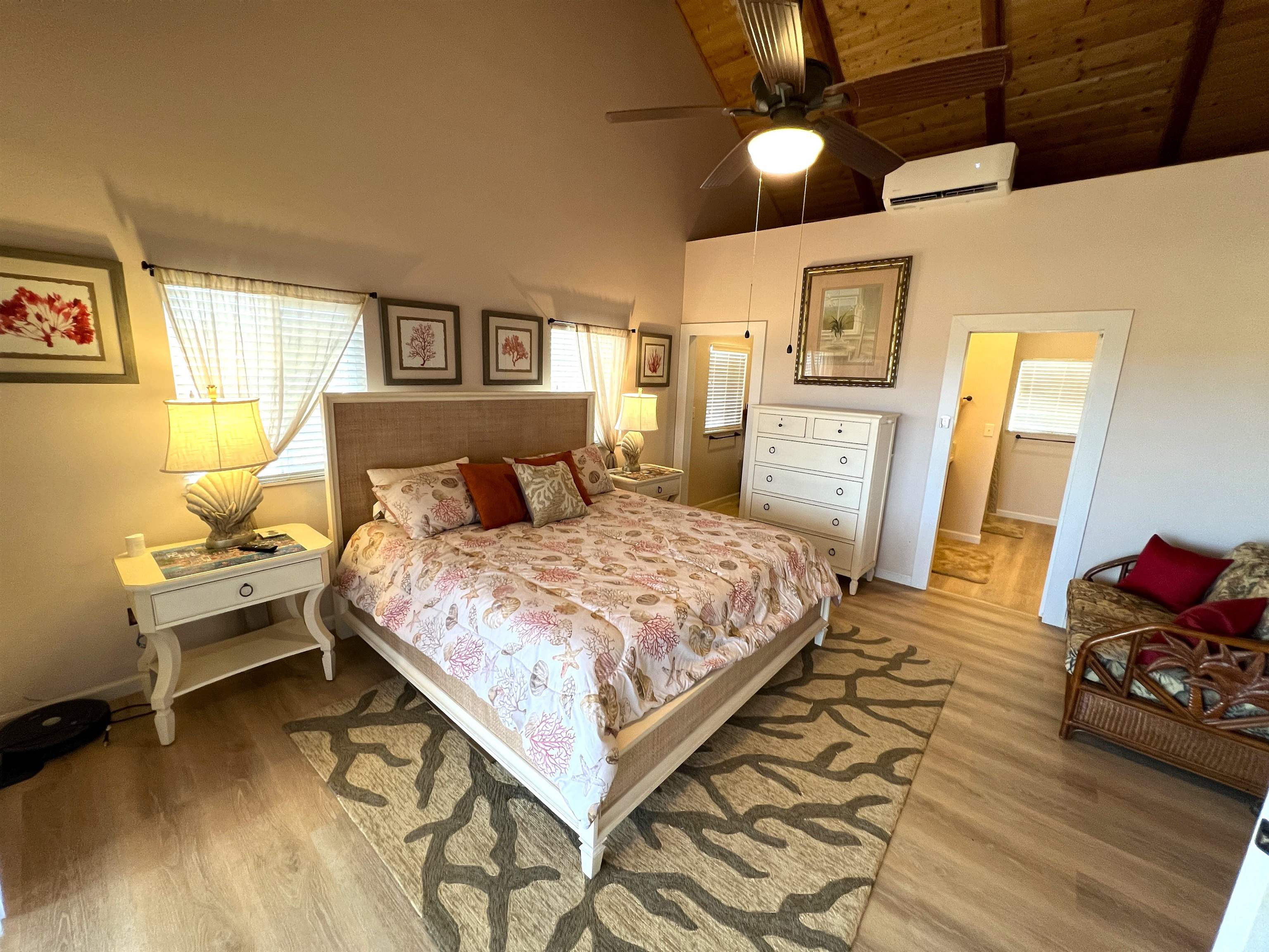 403 Pa Loa Loop, Unit LOT #221 Maunaloa, HI 96770 - Photo 20 of 33 a bedroom with a bed and wooden floor