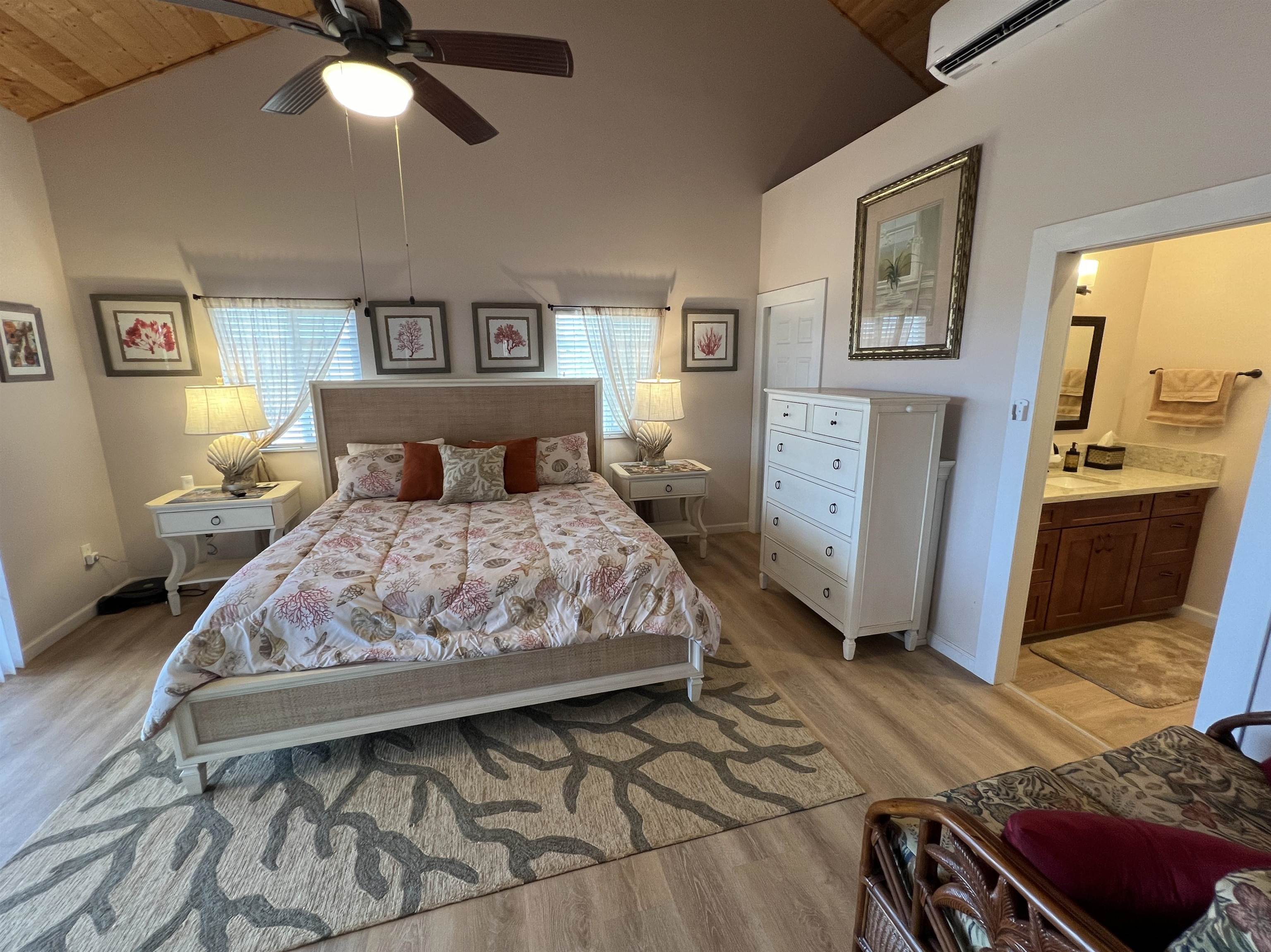 403 Pa Loa Loop, Unit LOT #221 Maunaloa, HI 96770 - Photo 21 of 33 a bedroom with a bed and wooden floor