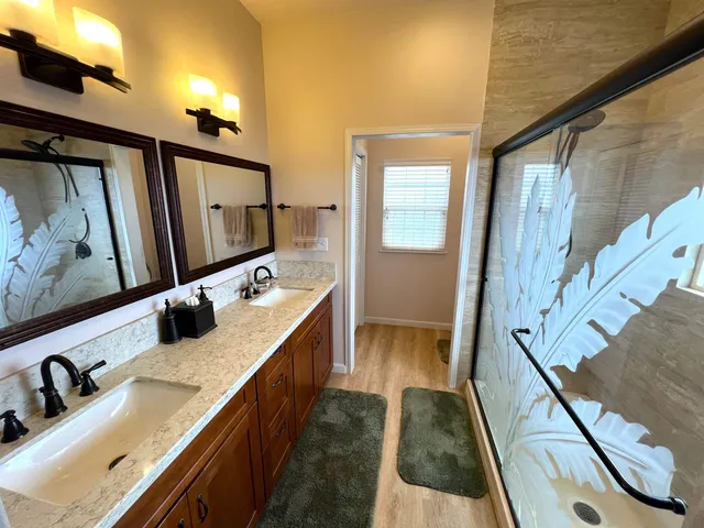 a bedroom with a bed window and couch