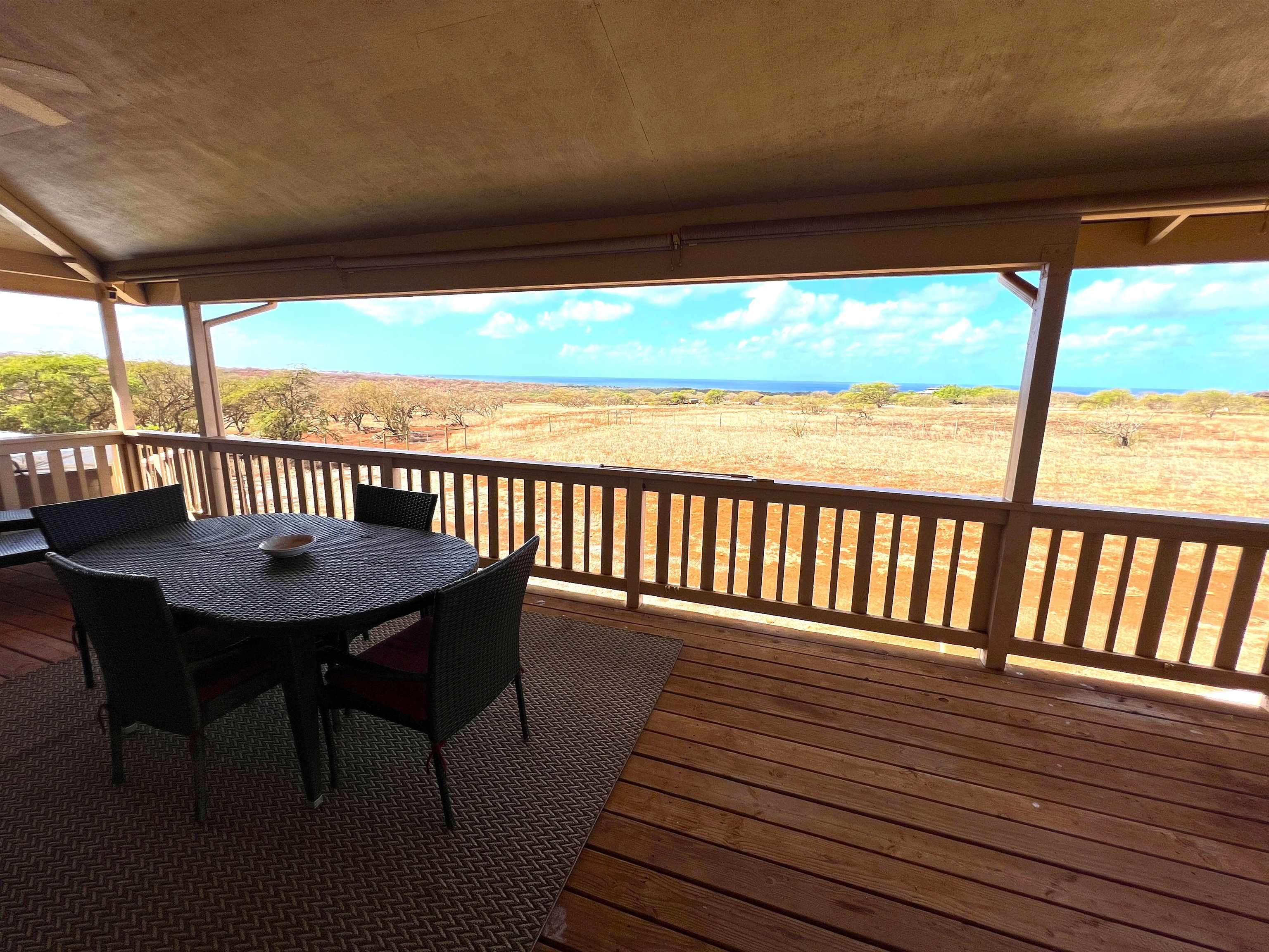 403 Pa Loa Loop, Unit LOT #221 Maunaloa, HI 96770 - Photo 30 of 33 a view of a balcony with wooden floor