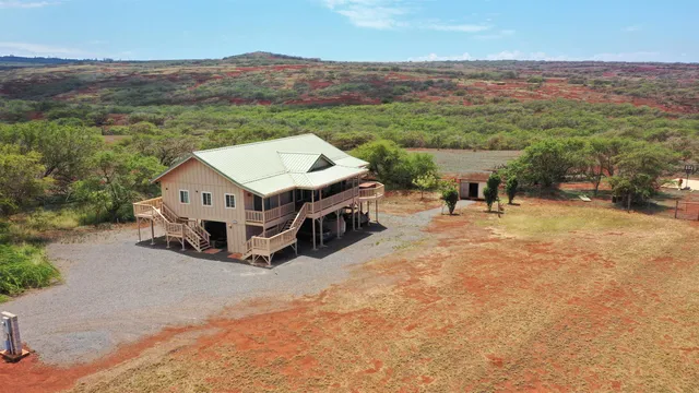 a view of a house with a mountain yard