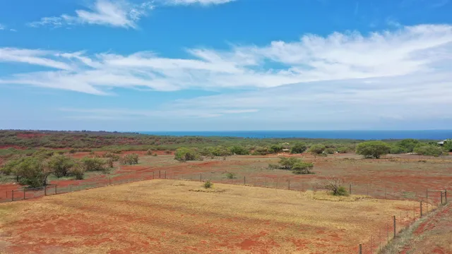 a view of a road with an ocean view