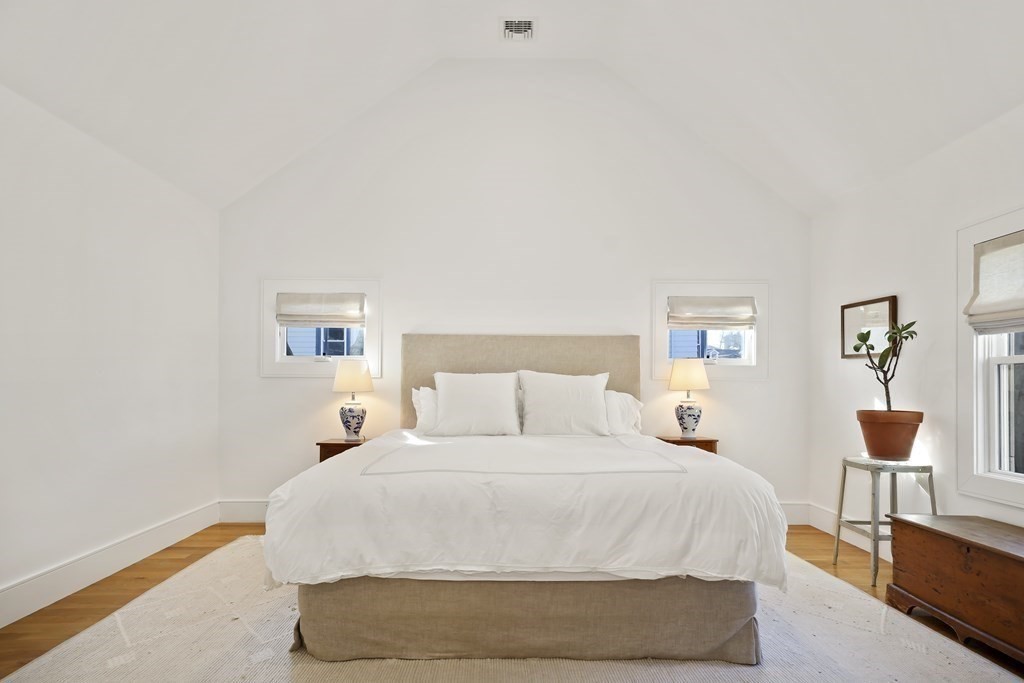 49 Boylston Street Boston, MA 02130 - Photo 11 of 36 a bedroom with a bed and a lamp