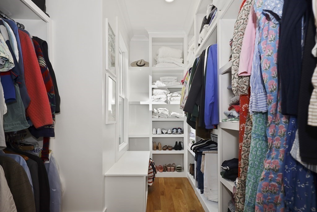 49 Boylston Street Boston, MA 02130 - Photo 16 of 36 a view of walk in closet with clothes and shoes