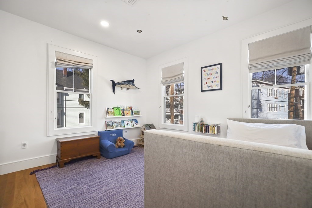49 Boylston Street Boston, MA 02130 - Photo 18 of 36 a living room with furniture and a window