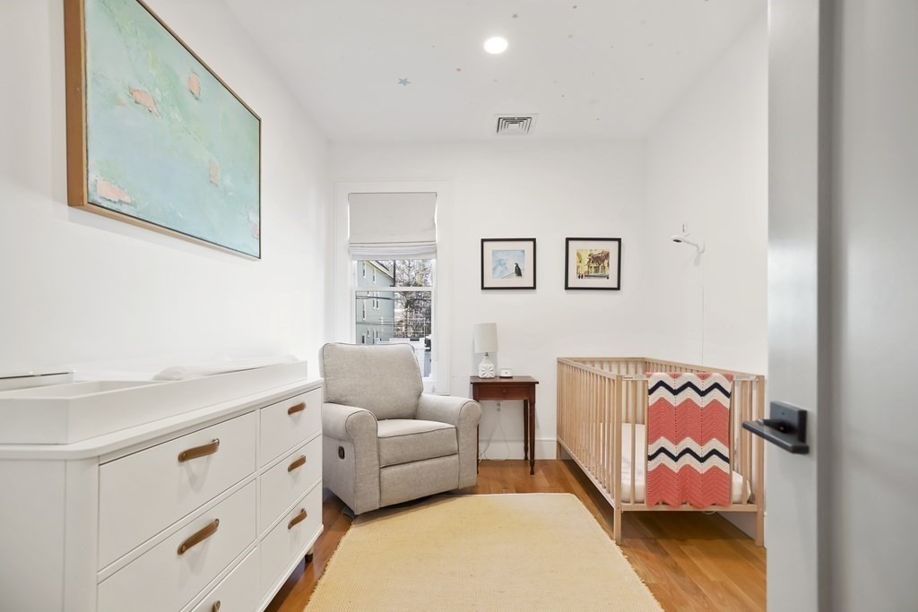 49 Boylston Street Boston, MA 02130 - Photo 19 of 36 a living room with furniture and painting on the wall