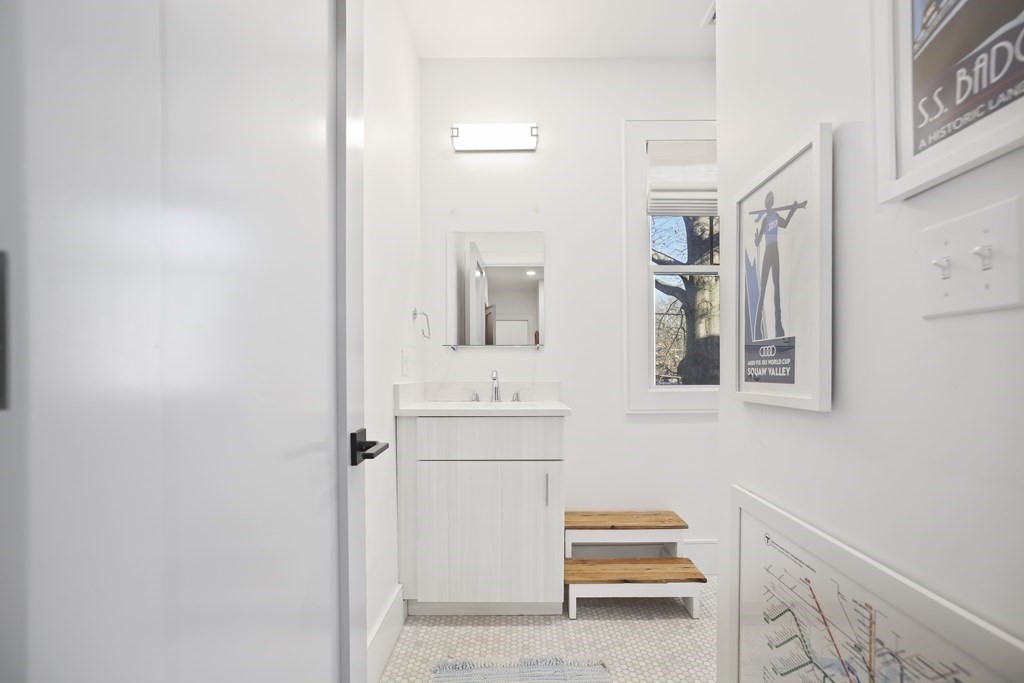 49 Boylston Street Boston, MA 02130 - Photo 20 of 36 a bathroom with a sink and a mirror