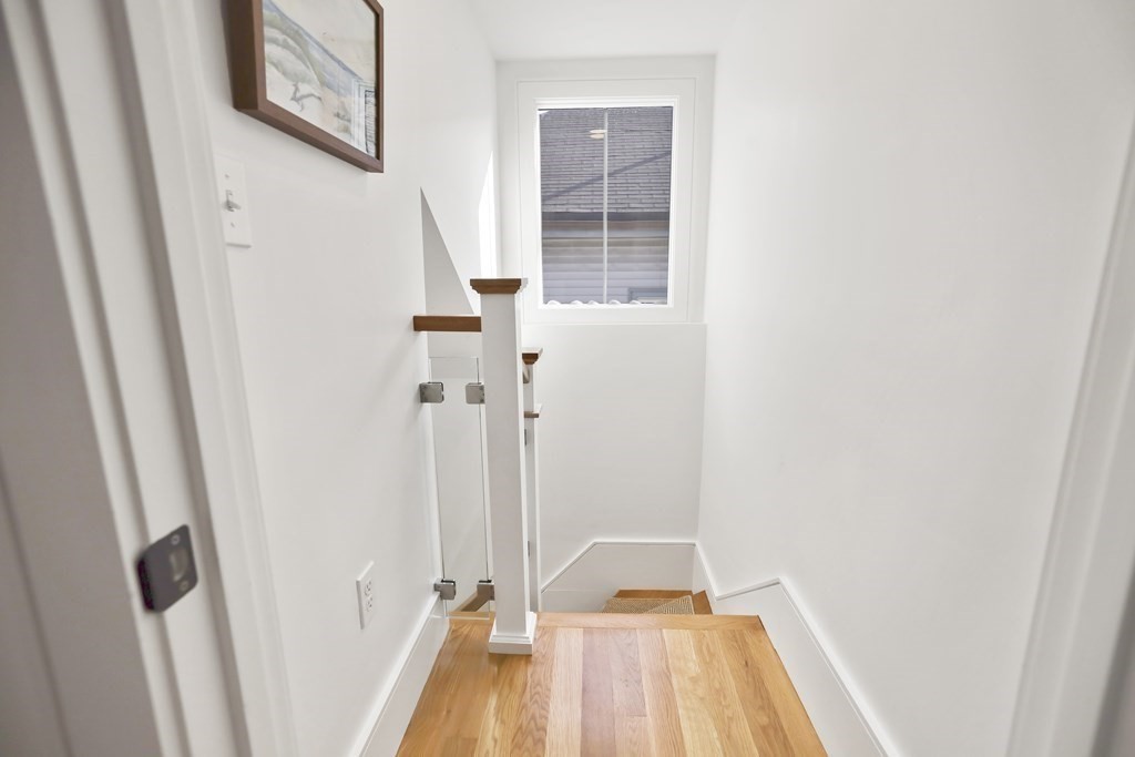 49 Boylston Street Boston, MA 02130 - Photo 28 of 36 a view of a hallway with wooden floor and closet