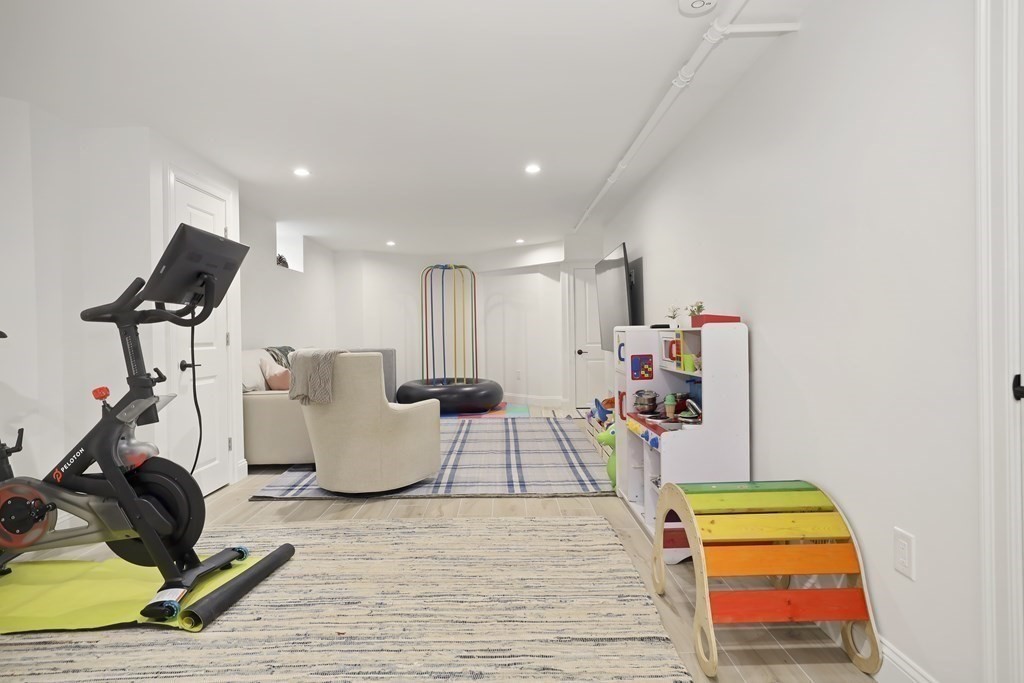 49 Boylston Street Boston, MA 02130 - Photo 29 of 36 a room with furniture and a wooden floor