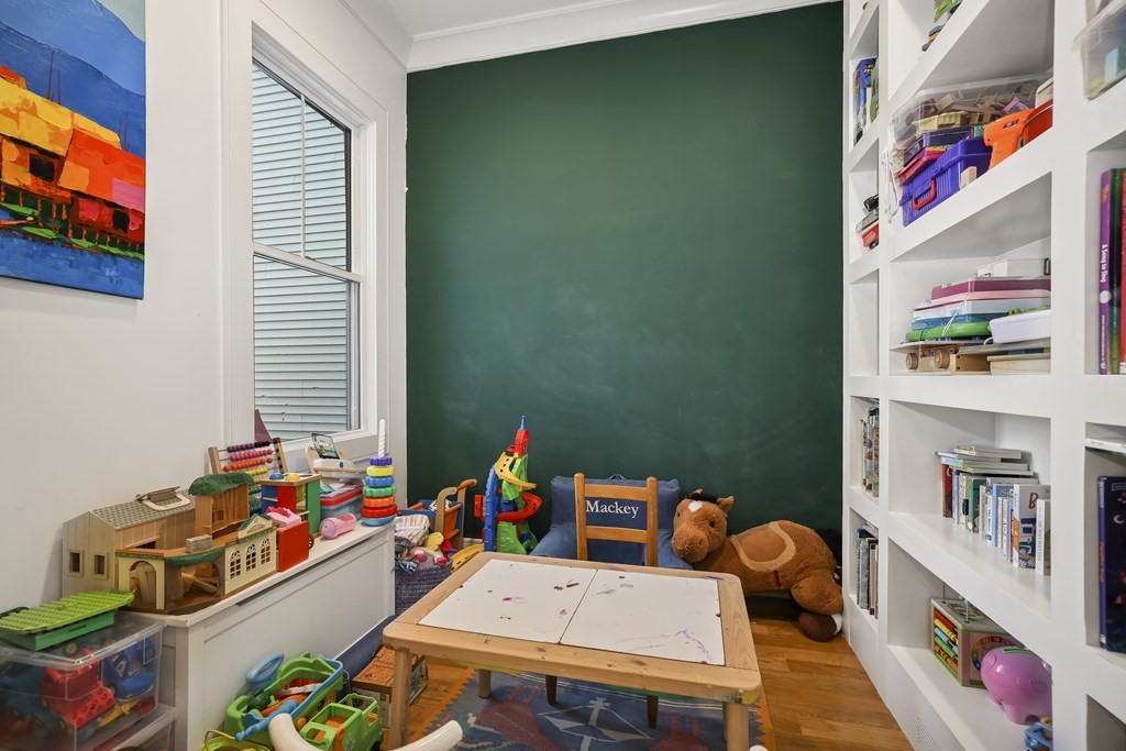 49 Boylston Street Boston, MA 02130 - Photo 36 of 36 a room with furniture and a book shelf