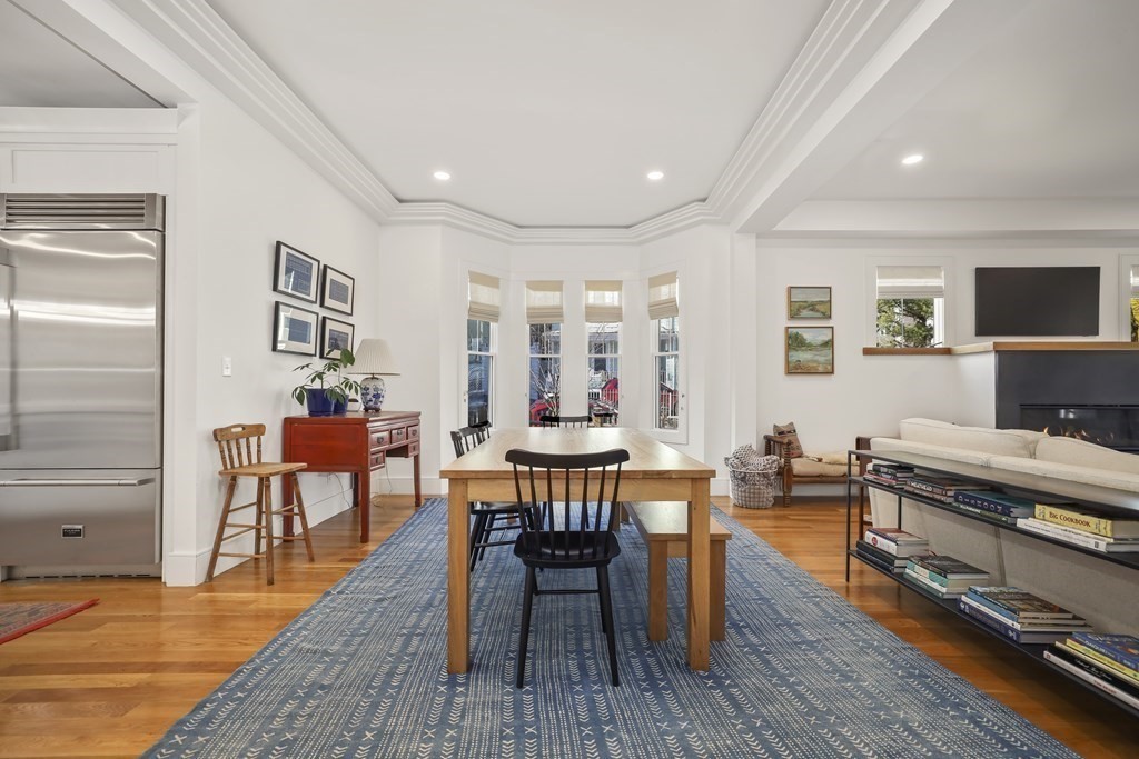 49 Boylston Street Boston, MA 02130 - Photo 4 of 36 a view of a dining room with furniture and wooden floor