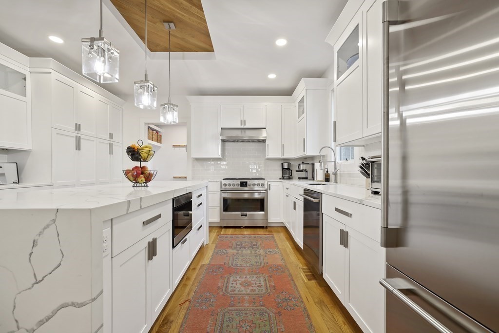 49 Boylston Street Boston, MA 02130 - Photo 7 of 36 a large kitchen with stainless steel appliances lots of counter space and a sink