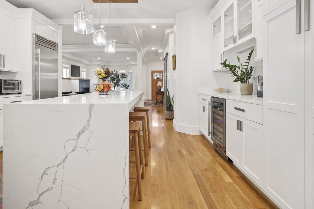 49 Boylston Street Boston, MA 02130 - Photo 8 of 36 a view of a kitchen with kitchen island a counter top space appliances and cabinets