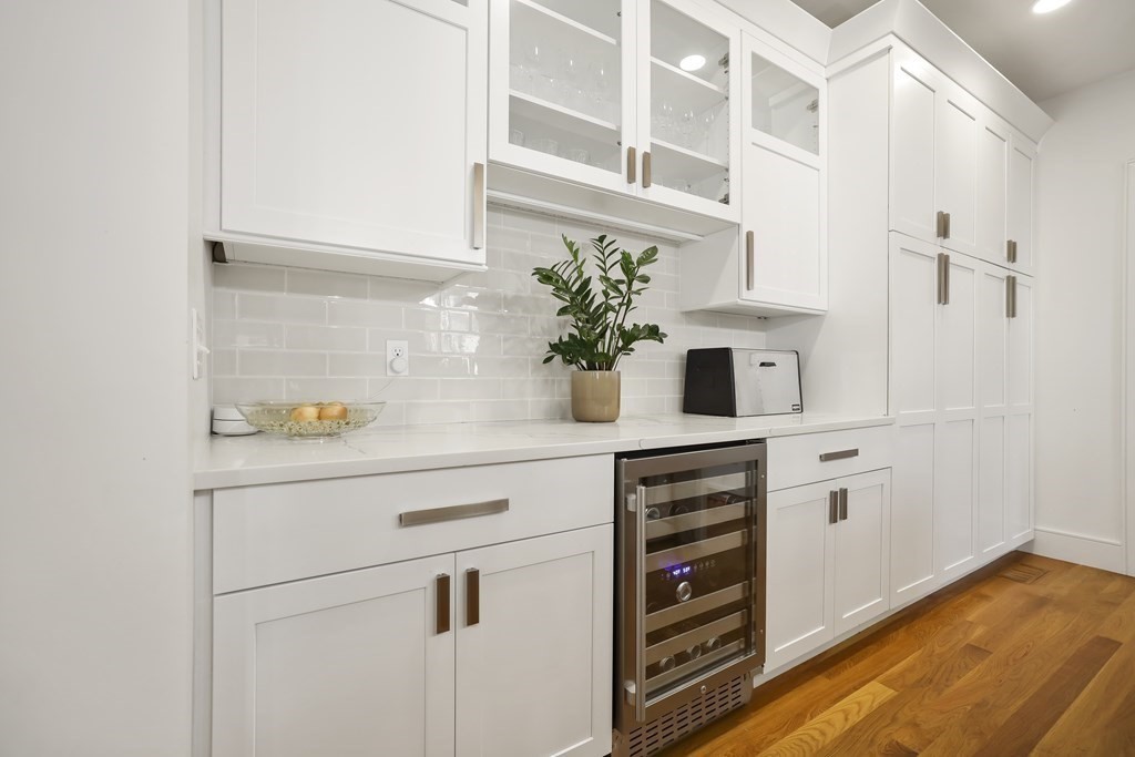 49 Boylston Street Boston, MA 02130 - Photo 9 of 36 a kitchen with a white cabinets and white appliances