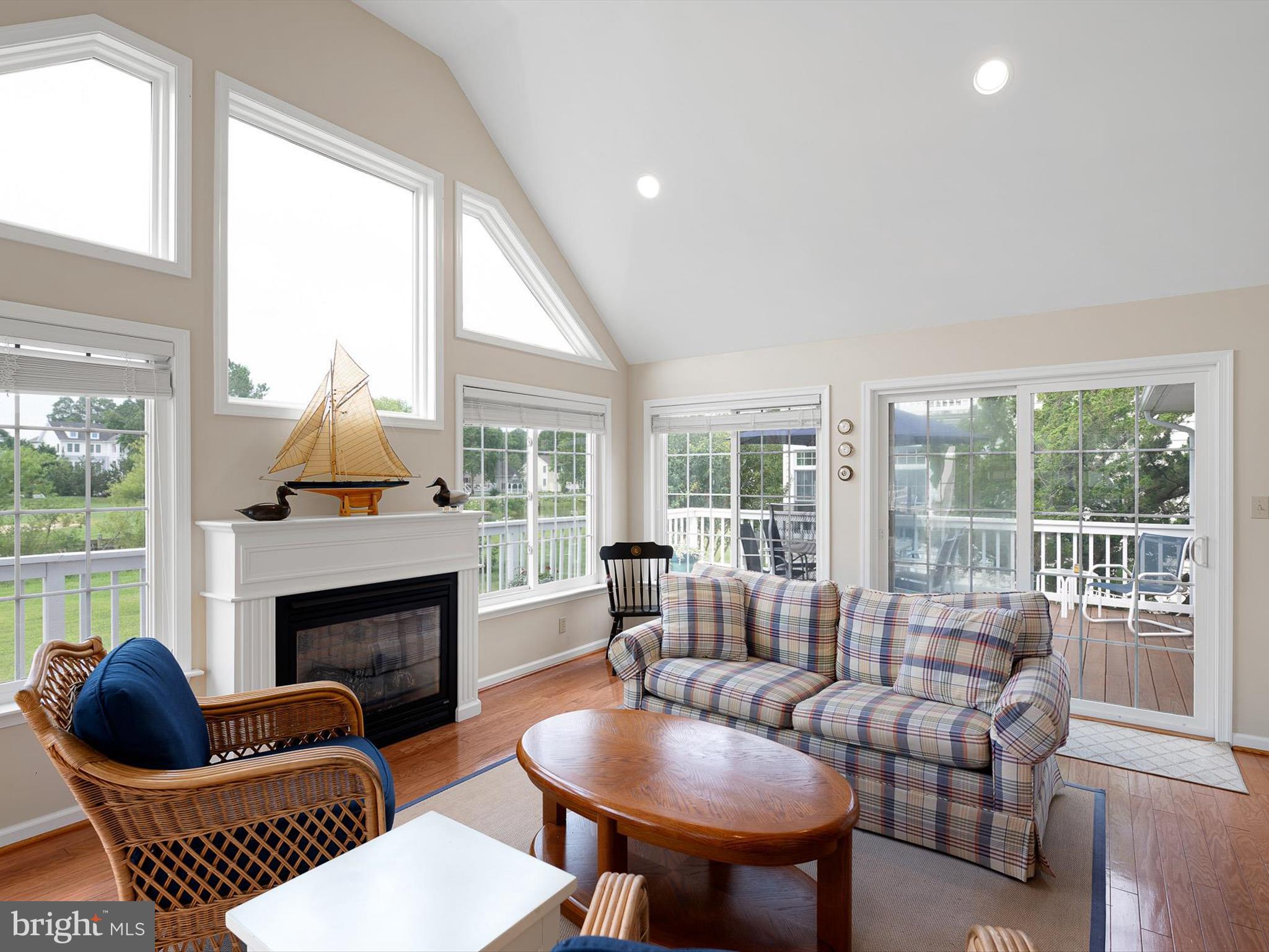 479 Bethany Loop Bethany Beach, DE 19930 - Photo 7 of 57 Accented by light-filled sunroom with fireplace.