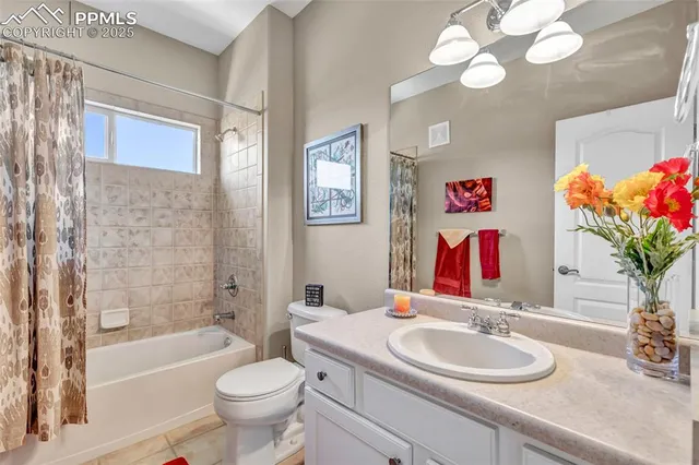 a bathroom with a sink a toilet and a shower