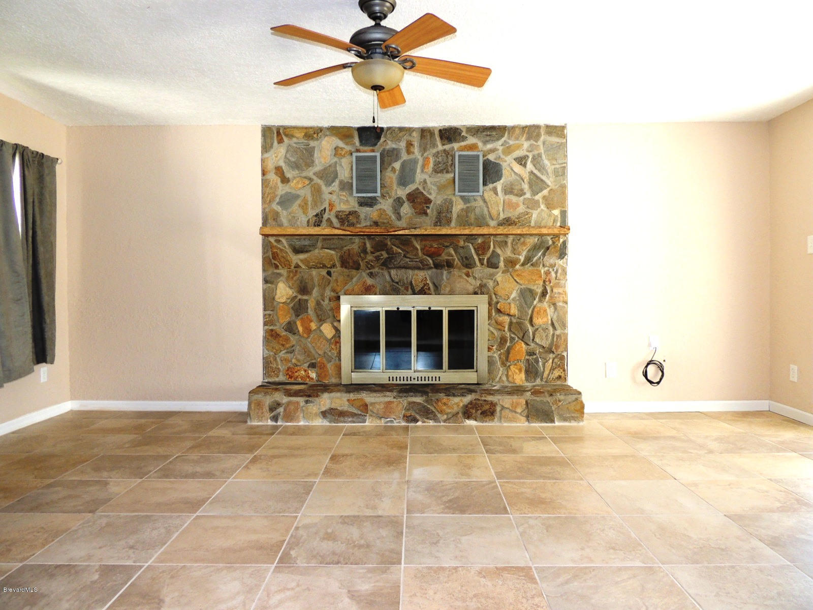 991 Beacon Road Rockledge, FL 32955 - Photo 5 of 13 Fireplace in the Family Room