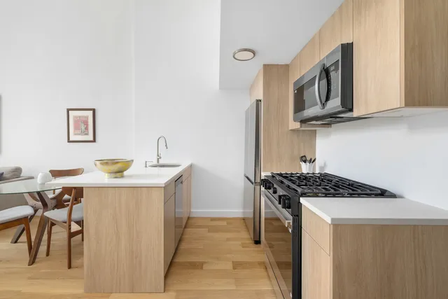 a kitchen with a stove and a refrigerator